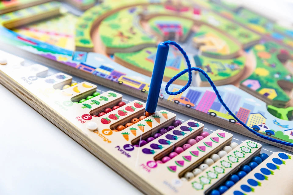Magnetic pen held upright above the colored sorting columns