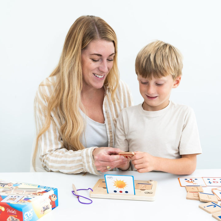 An adult and child exploring CVC Word Magic