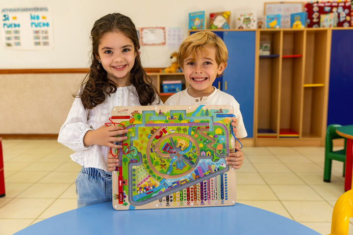 Two children holding the Owl Village Storytime Magnetic Maze