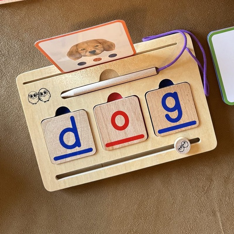 CVC Word Magic board with the word dog built from tiles